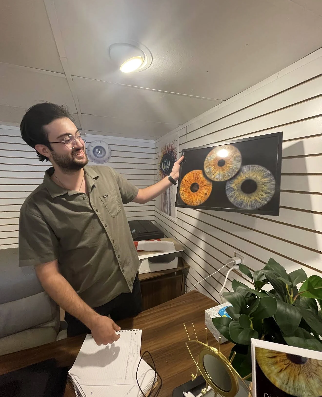 Eyes of Art artist presenting a framed iris composition